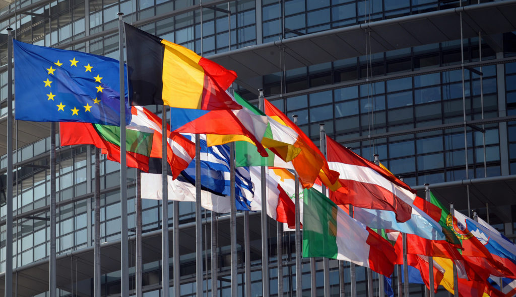 (FILES) A file photo taken on April 24, 2009 shows the European Union flag and national flags in front of the European Parliament in Strasbourg, eastern France. The Nobel Peace Prize was on October 12, 2012 awarded to the European Union, an institution currently wracked by crisis but is credited with bringing more than a half century of peace to a continent ripped apart by World War II.  AFP PHOTO / FREDERICK FLORIN