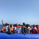 Taken from a "rhib", an inflatable dinghy, belonging to the 'Ocean Viking' rescue ship, operated by French NGOs SOS Mediterranee and Medecins sans Frontieres (MSF), some 81 migrants are rescued during an operation in the Mediterranean Sea on August 11, 2019. - The rescue operation comes as a dispute escalates over which countries will take in migrants rescued by different charity ships operating in the area, as mild Mediterranean weather increases the number of people trying to make their way to Europe from Africa. (Photo by Anne CHAON / AFP)