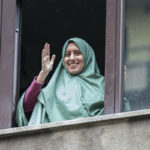 Silvia Romano smiles from a window after she arrived at her home, in Milan, Italy, 11 May 2020. The young Italian woman has returned to her homeland after 18 months as a hostage in eastern Africa.  ANSA/Marco Ottico