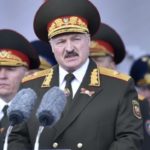 Belarusian President Alexander Lukashenko, center, gives a speech during a military parade that marked the 75th anniversary of the allied victory over Nazi Germany, in Minsk, Belarus, Saturday, May 9, 2020. (Sergei Gapon/Pool Photo via AP)
